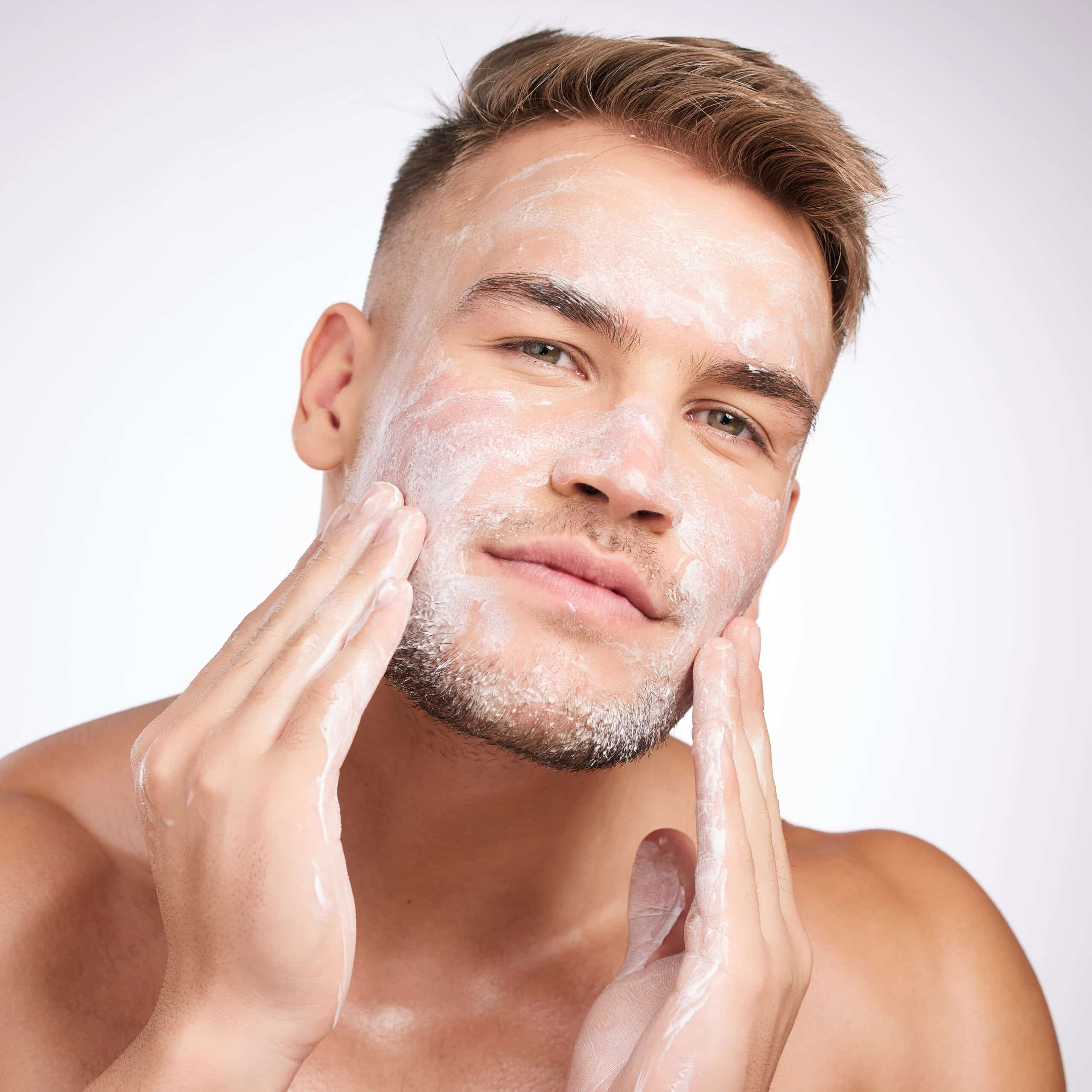 rosacea considerations man using a skin care product